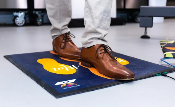 George Tulloch demonstrates the tandem stance on the Balance Mat